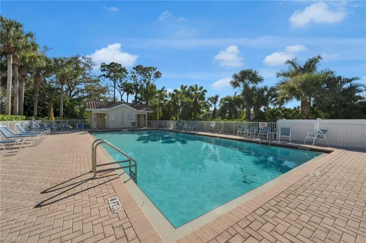 Community pool featuring a patio