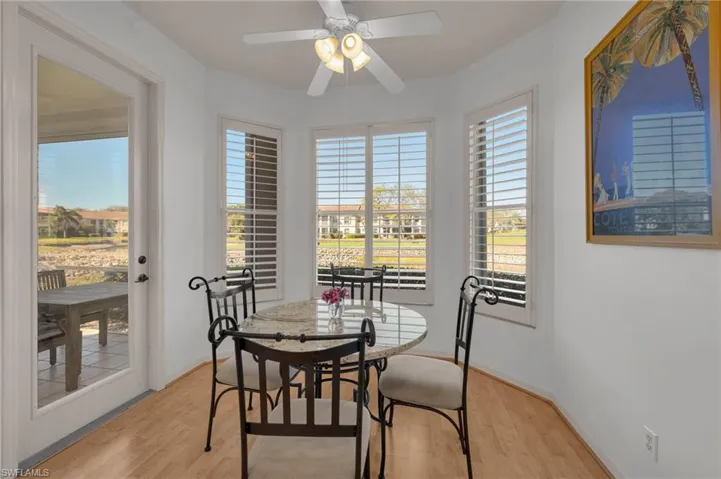 Breakfast area featuring laminate d floors and a ceiling fan
