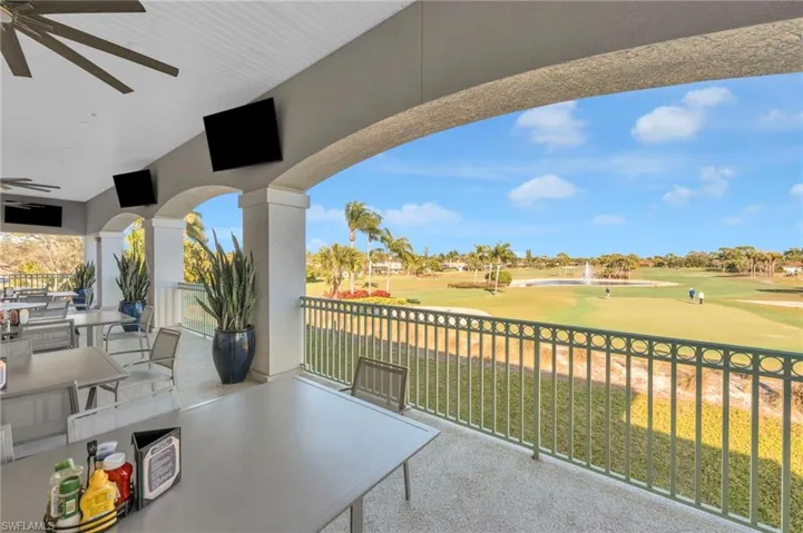 Clubhouse View of patio / terrace with outdoor dining space and ceiling fan