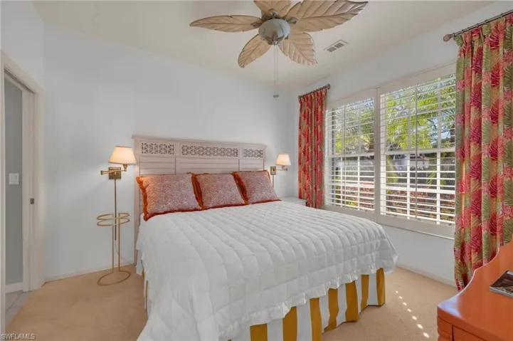 Bedroom featuring ceiling fan and light colored carpet