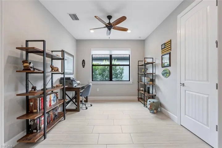 Home office featuring a ceiling fan and recessed lighting