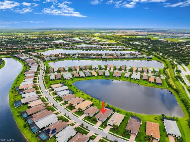 Aerial perspective of suburban area with a large body of water