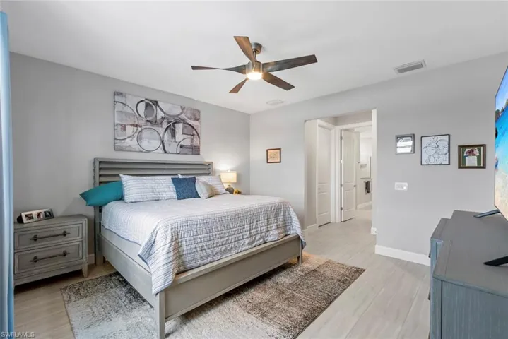 Bedroom with light wood-style flooring and ceiling fan