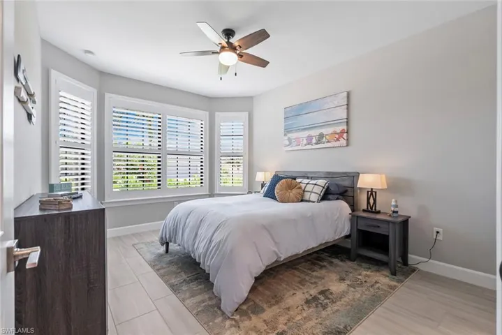 Bedroom featuring baseboards and ceiling fan