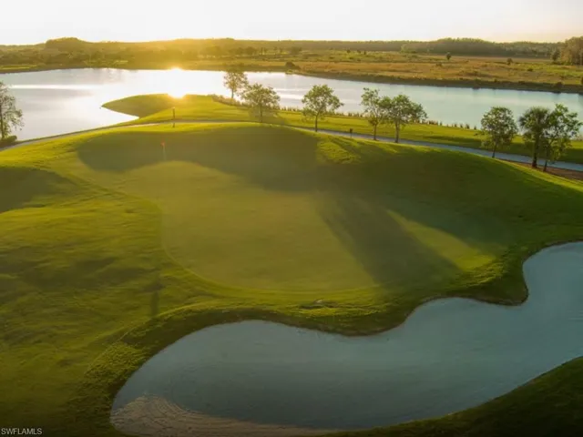 View of home's community with a water view and golf course view