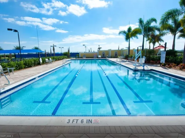 Community pool featuring a patio