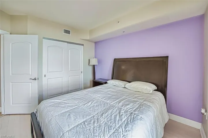 Bedroom with a closet and light wood-style floors