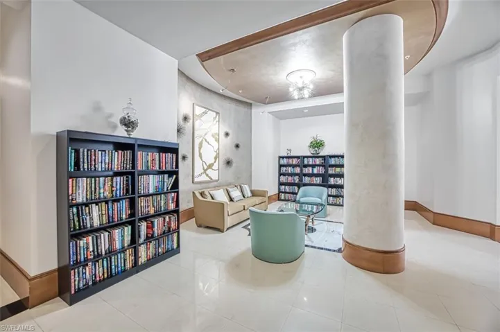 Living area featuring wall of books