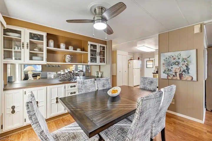 Dining room featuring light wood-type flooring and ceiling fan
