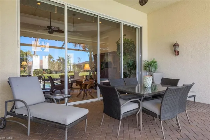 Sunroom featuring a ceiling fan
