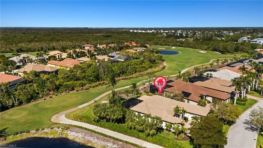 Birds eye view of property featuring view of golf course and a residential view