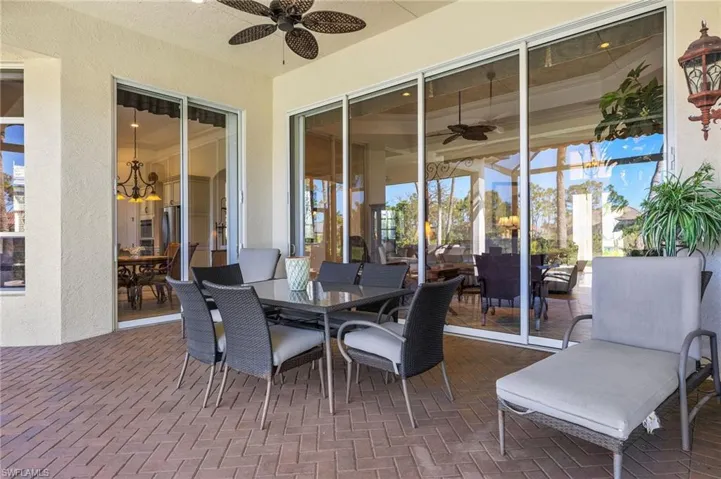 Sunroom featuring a ceiling fan