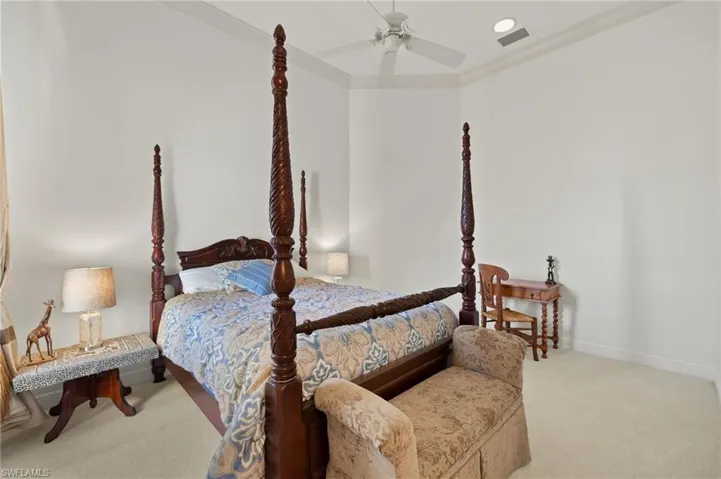 Carpeted bedroom with recessed lighting, visible vents, ornamental molding, a ceiling fan, and baseboards
