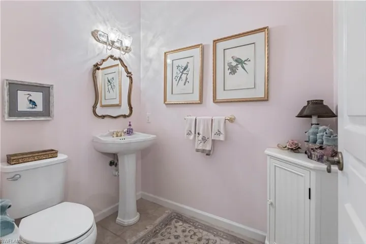 Bathroom featuring sink, tile patterned floors, and toilet