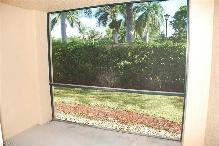 Screen enclosed lanai overlooking landscaped space (old photo)