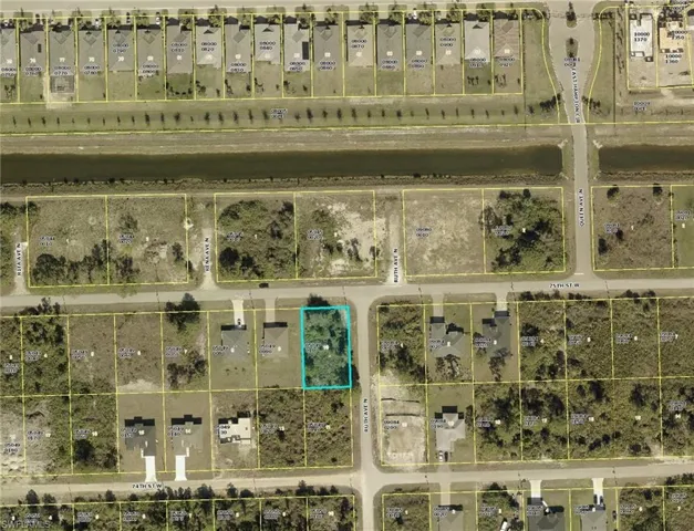 Aerial view of property's location featuring property parcel outlined