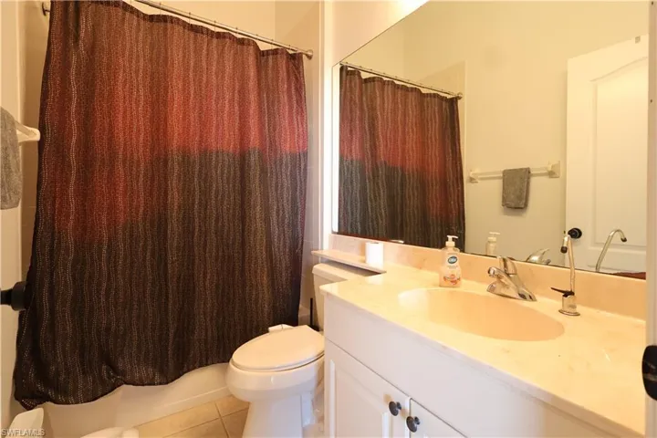 Bathroom featuring vanity and light tile patterned floors