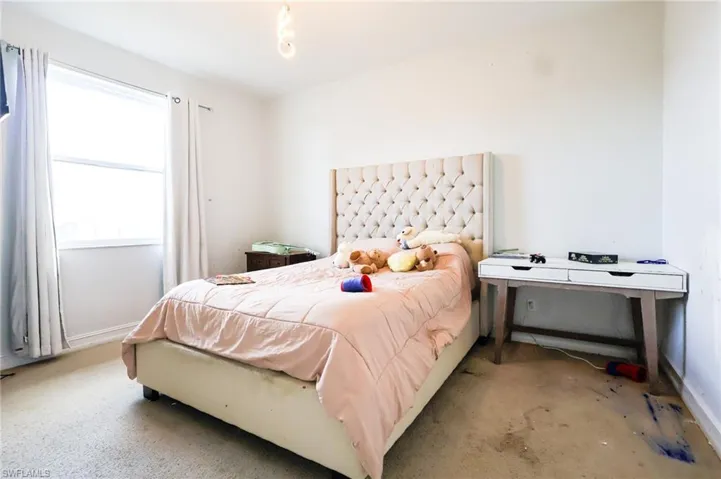 Bedroom featuring baseboards
