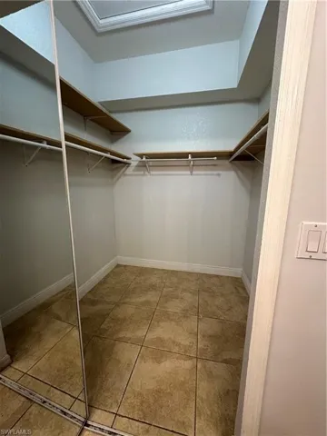 Spacious closet featuring light tile patterned floors