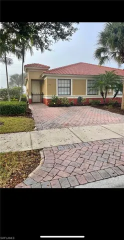 View of front facade featuring stucco siding