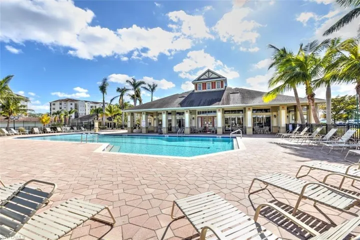 Community pool with a patio area