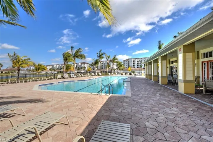 Community pool featuring a patio