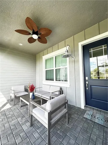 View of patio featuring an outdoor lounge area and ceiling fan