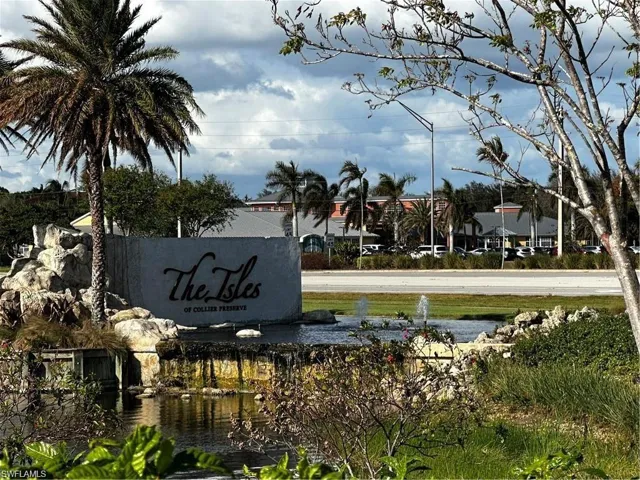 Community / neighborhood sign with a water view