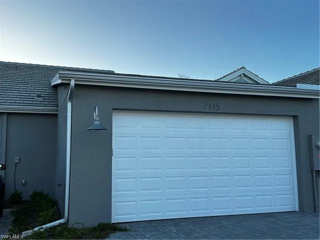 Garage featuring driveway