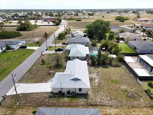 Drone / aerial view with a residential view looking toward Pine Island Road