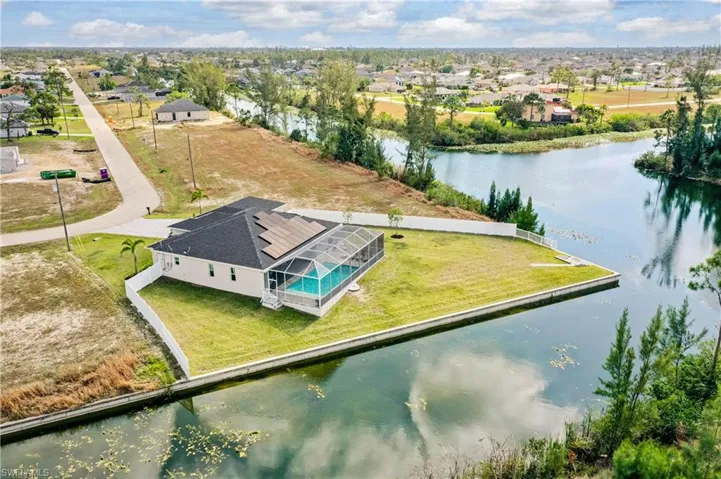Bird's eye view featuring a water view and a residential view