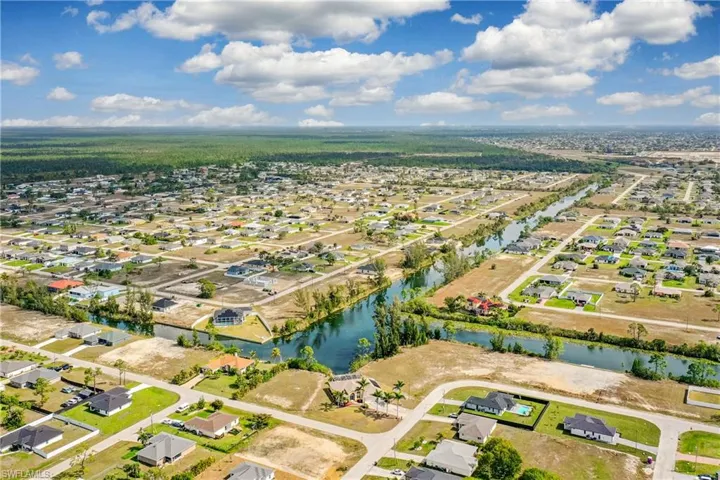 Bird's eye view featuring a water view and a residential view