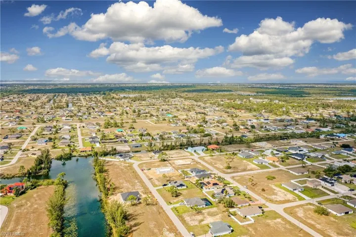 Bird's eye view with a water view and a residential view