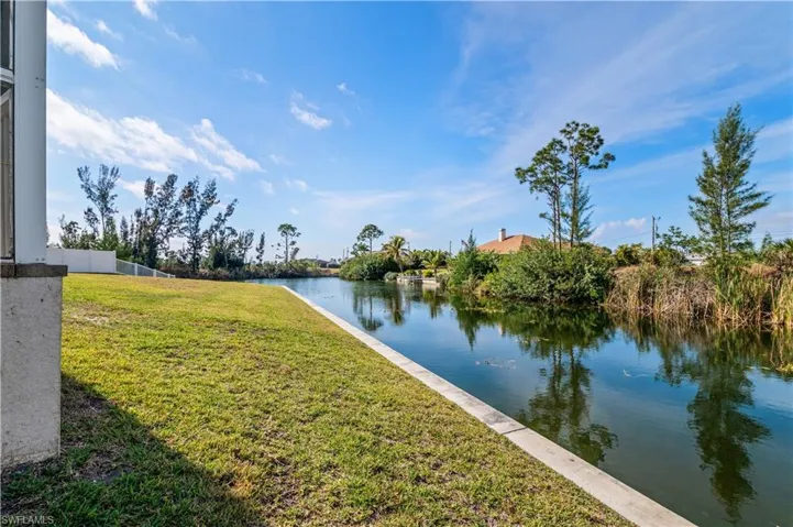 Property view of water featuring fence
