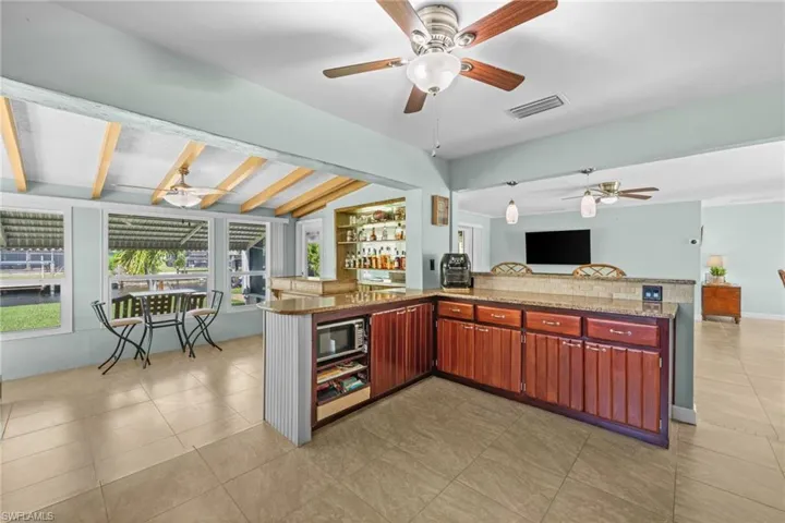 Open kitchen design keeps everyone connected.