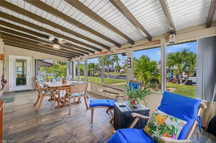 Expansive screened lanai overlooking the backyard and canal!