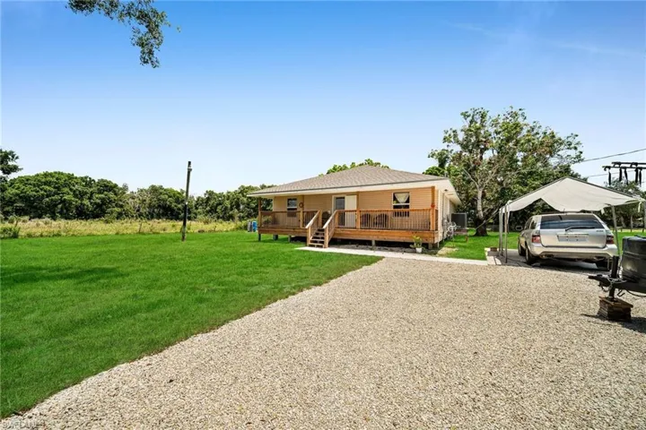 View of yard featuring a wooden deck