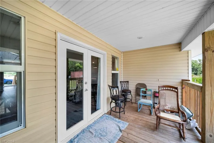Wooden deck featuring french doors