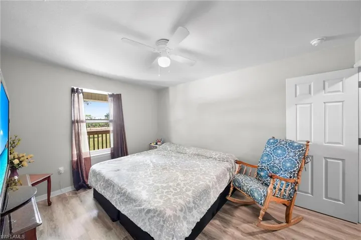 Bedroom featuring light wood-type flooring and ceiling fan