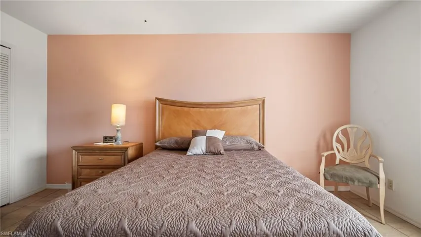 Bedroom with light tile patterned floors