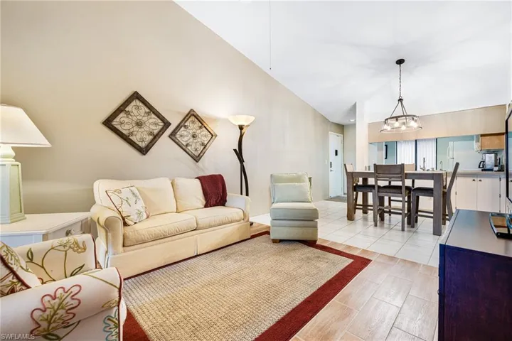 Living room featuring light hardwood / wood-style floors and an inviting chandelier