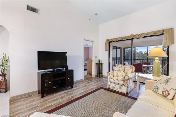 Living room with high vaulted ceiling