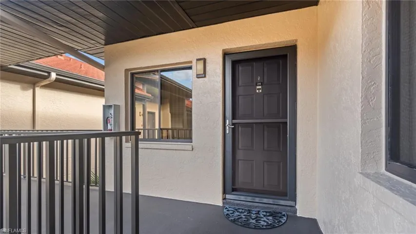 Doorway to property with a balcony
