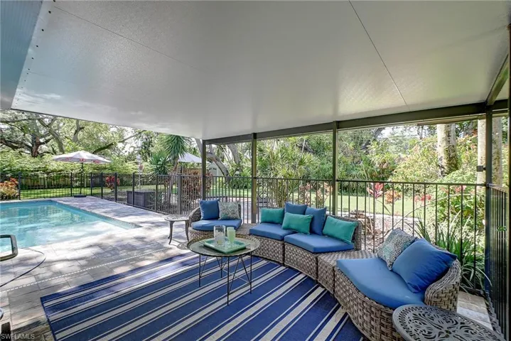 covered patio overlooking the large pool
