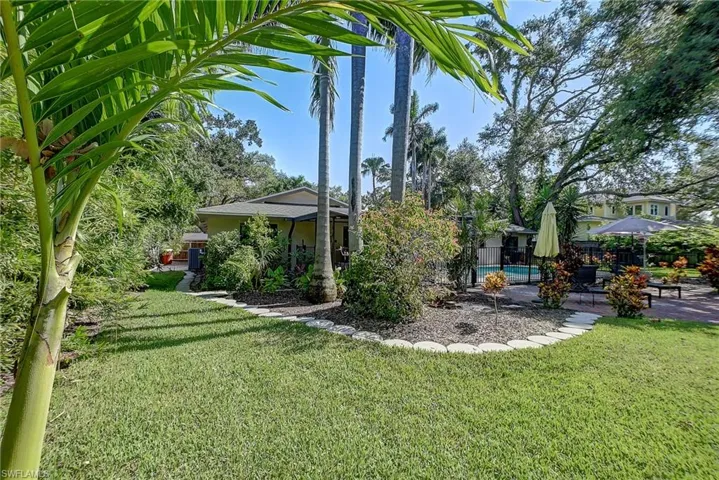 View of backyard looking at patio