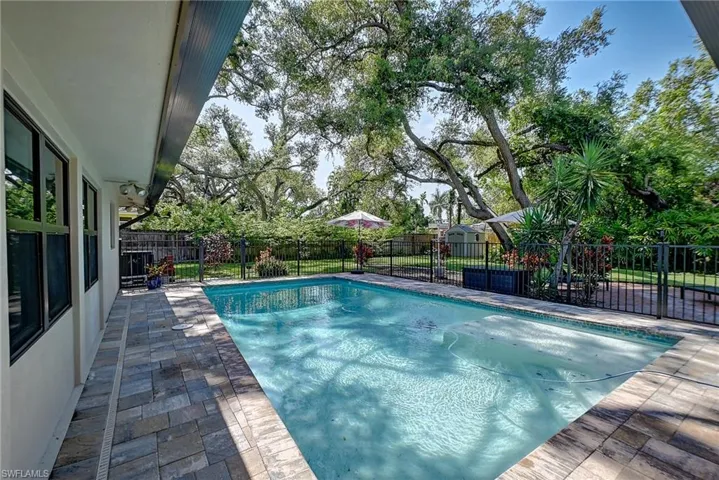 View of swimming pool with a patio area