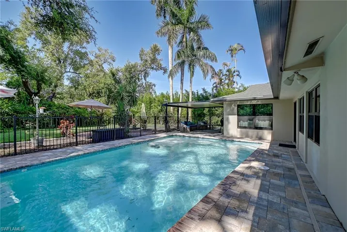 View of pool with a covered patio area