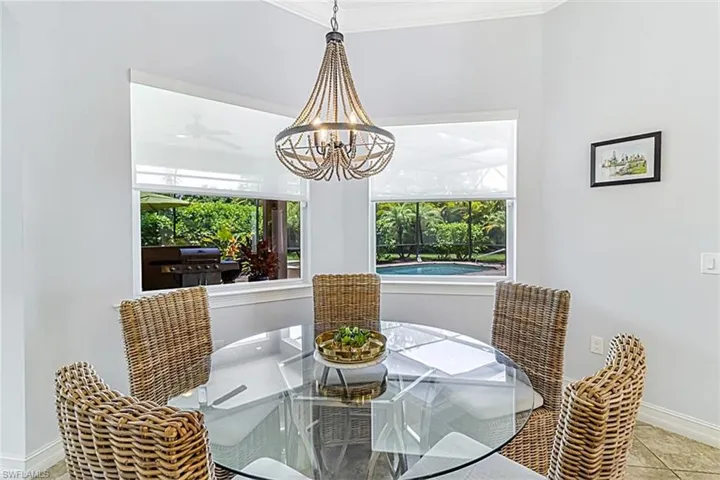 Breakfast area featuring crown molding and a chandelier
