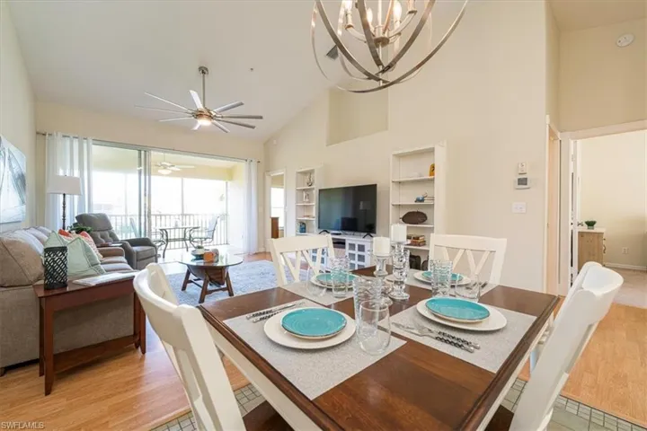 Dining Room with modern light fixture & ceiling fan