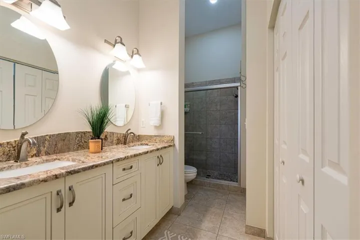 Primary Bath with updated vanity with dual sinks & walk-in shower